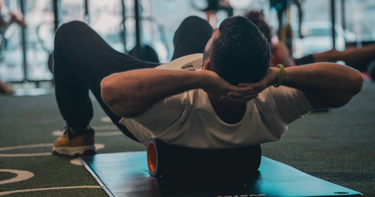 Athlete doing dynamic warm-up exercises before lifting