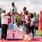 Podium Crasher Ladies captain Esther Kioko receives the 7th edition winners award from Absa Life Assurance Kenya Managing Director Githanji Waiguru