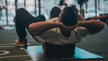 Athlete doing dynamic warm-up exercises before lifting