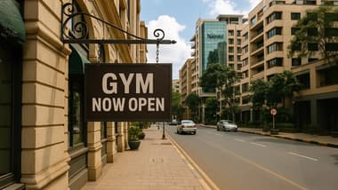 Gym now open sign on a street in Nairobi