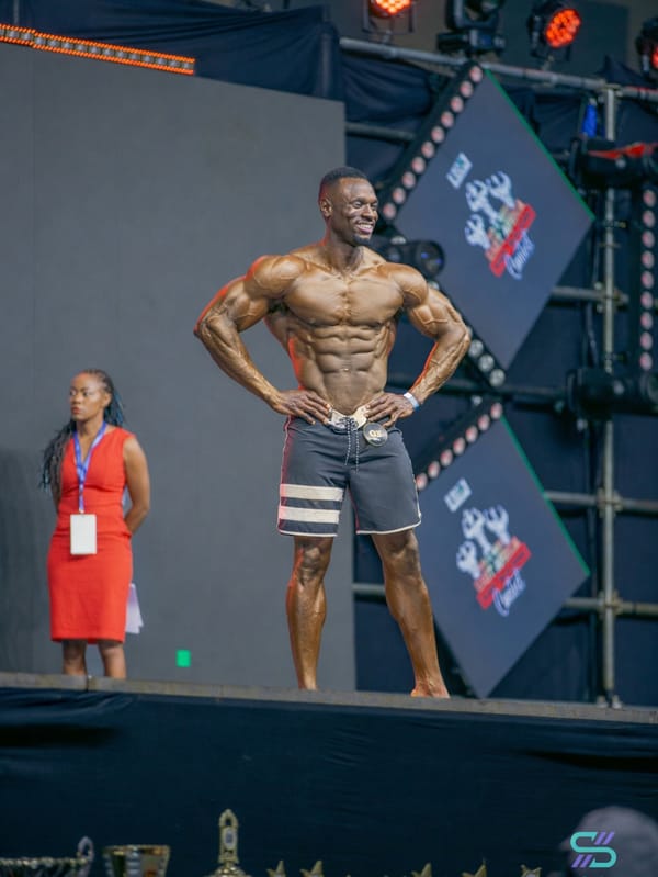 Desmond Tutu posing on stage at Mr East Africa 2024