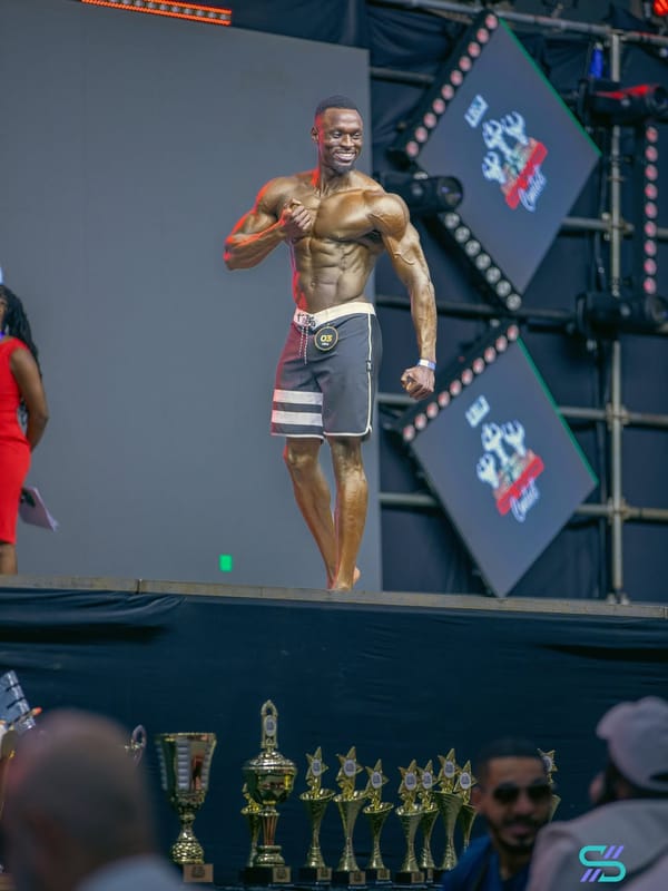 Desmond Tutu side pose on stage at Mr East Africa 2024