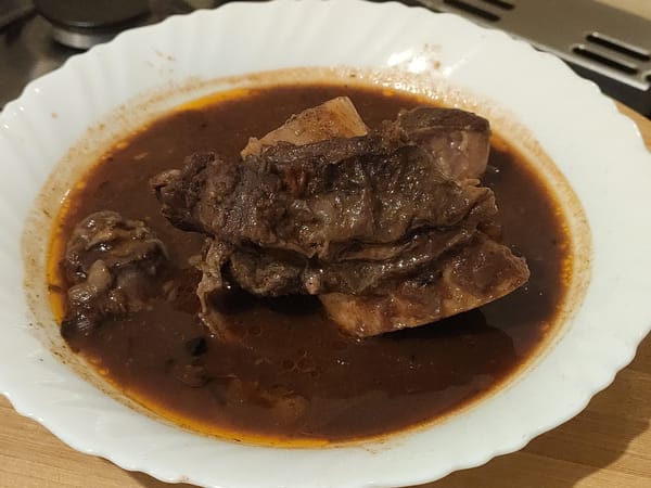 A plate of authentic Kenyan beef stew (nyama ya kuchemsha) in rich brown gravy