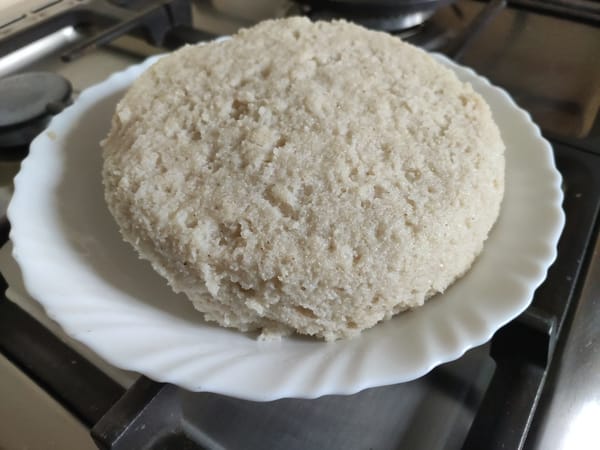 Close-up of freshly cooked stiff white ugali on a plate