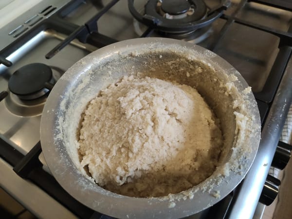 Freshly cooked stiff ugali still shaped in the sufuria
