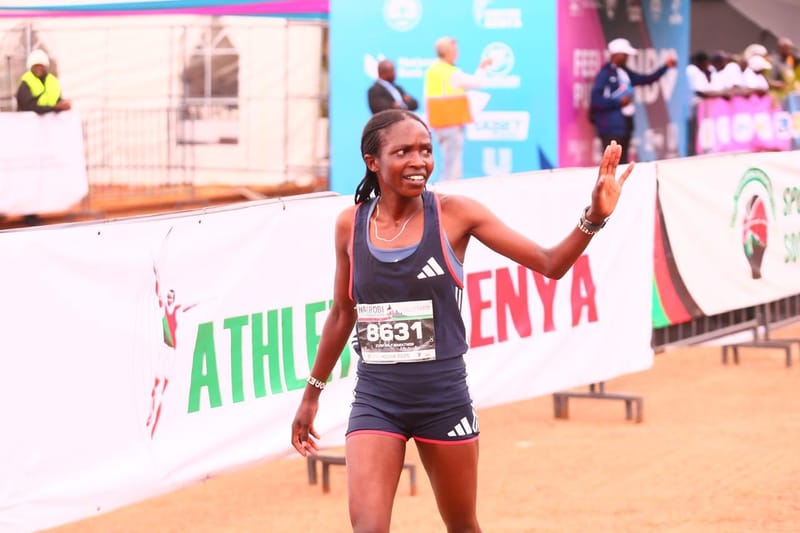 Doreen Cherop Kibet waves after winning the women