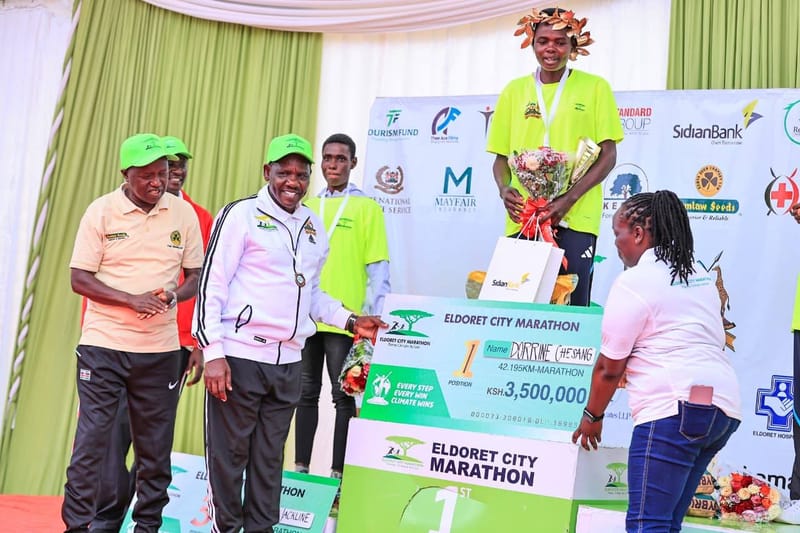 Dorrine Chesang holding cash award after winning Eldoret City Marathon 2026