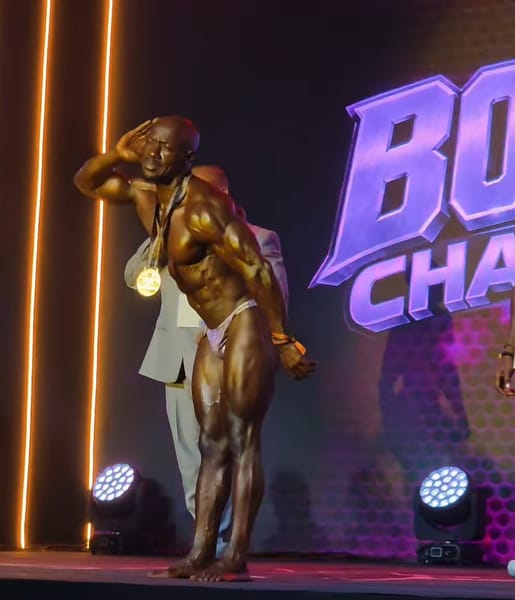 Peter Ochino wearing his Masters Men medal at Body Fuel Championship 2026
