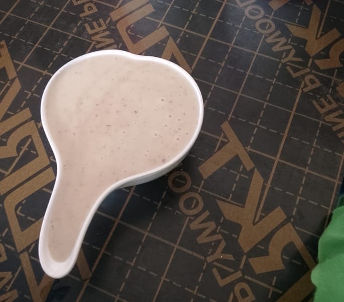Uji power served in a calabash bowl at a Kenyan restaurant
