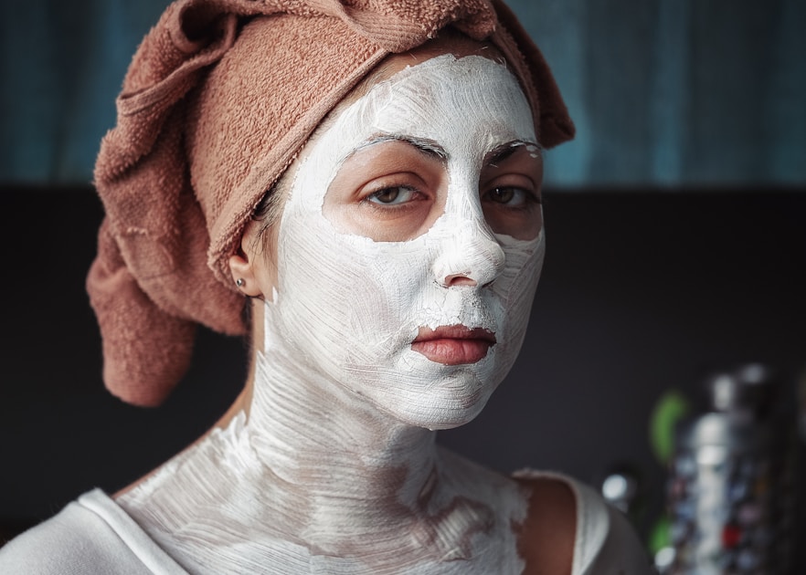 a person applying skincare cream to their face
